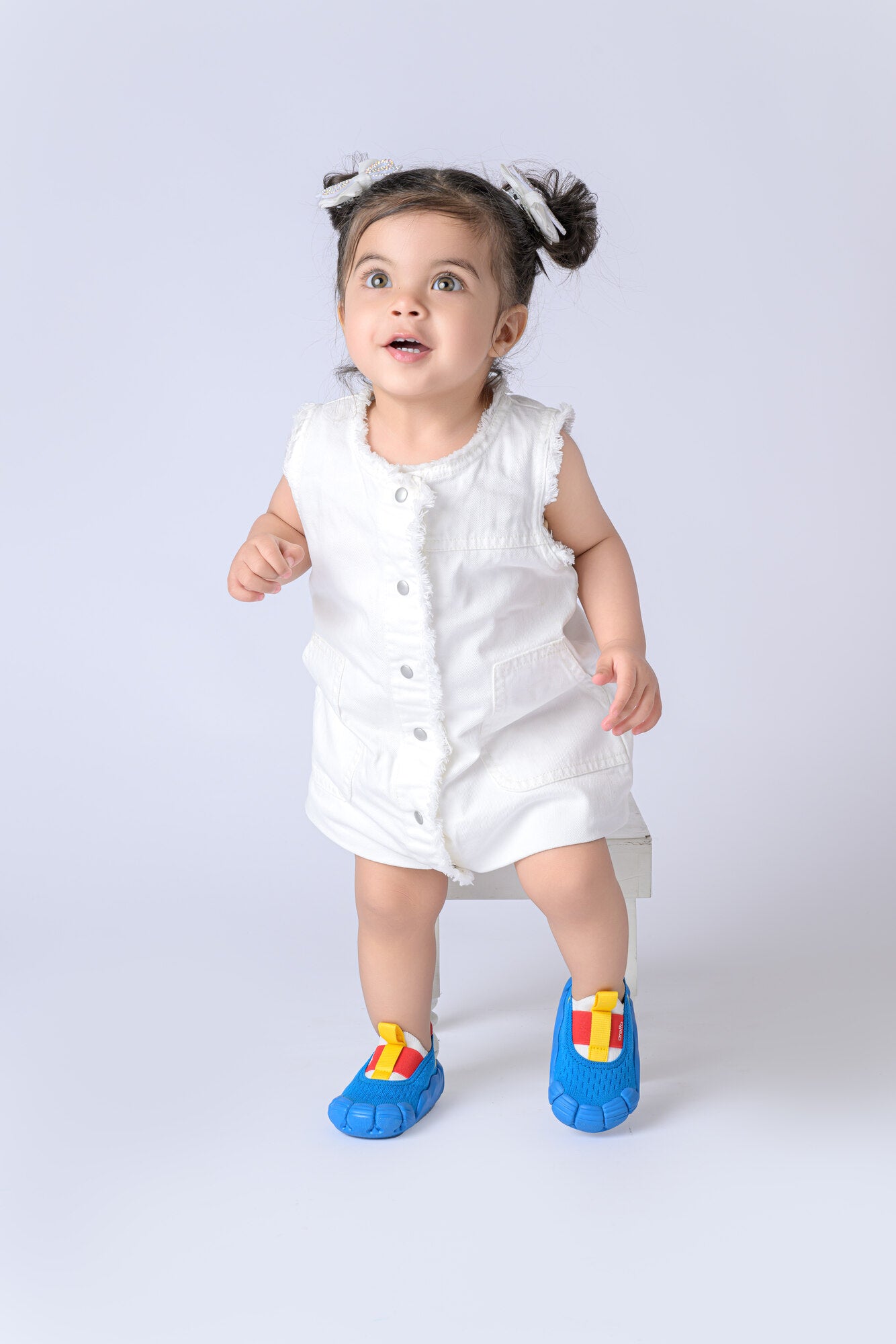 Girl Wearing Aretto Shoes in the vColourway Happy Hopper