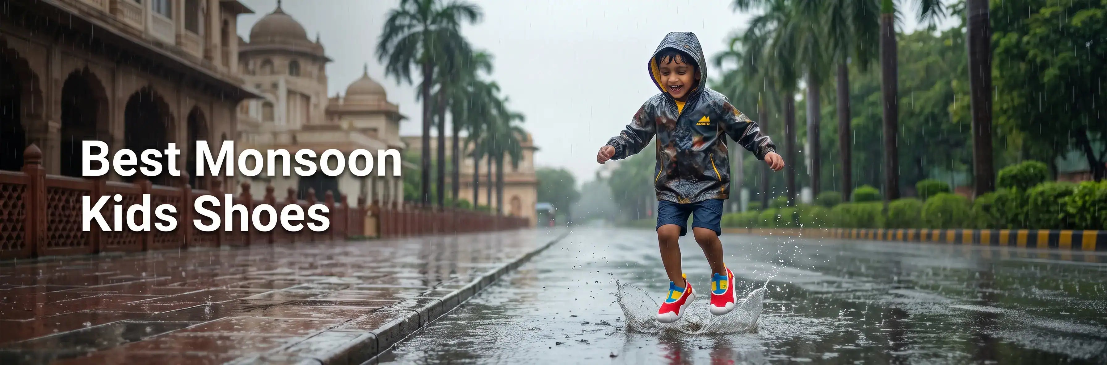 A young Indian boy in a rain jacket smiling and splashing in a puddle on a wet street during the monsoon season, wearing colorful Aretto kids' shoes.