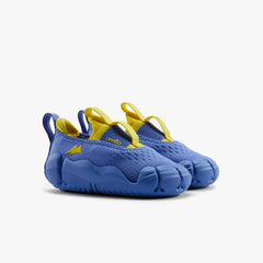 A pair of purple Aretto kids' shoes with flexible white segmented soles, displayed side-by-side against a white background. (Sizes S1 & S2)