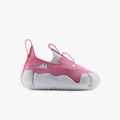 Side profile view of a single Aretto kids' shoe, highlighting the soft pink knit upper and ergonomic white sole. (Sizes S1 & S2)