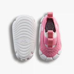 Top-down studio shot of a pair of Aretto shoes, showcasing the pink knit upper alongside the flexible, speckled white outsole. (Sizes S1 & S2)