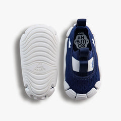 Top-down studio shot of a pair of Aretto shoes, showcasing the navy blue knit upper alongside the flexible, speckled white outsole. (Sizes S1 & S2)