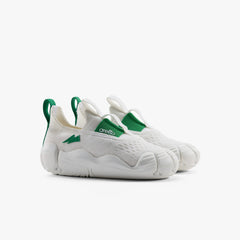 A pair of crisp white Aretto kids' shoes with flexible white segmented soles, displayed side-by-side against a white background. (Sizes S3 & S4)