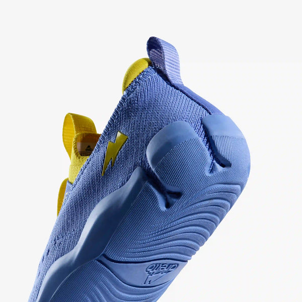 Macro close-up of the heel and outsole of an Aretto shoe, detailing the patented, flexible Y-shaped Supergrooves sole technology. (Sizes S3 & S4)