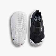 Top-down studio shot of a pair of Aretto shoes, showcasing the black knit upper alongside the flexible, speckled white outsole. (Sizes S3 & S4)
