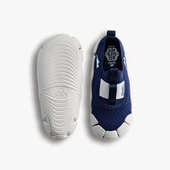 Top-down studio shot of a pair of Aretto shoes, showcasing the navy blue knit upper alongside the flexible, speckled white outsole. (Sizes S5 & S6)