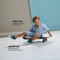 Infographic of a young child on a skateboard, featuring callouts for the zero-drop sole and the shoe's ability to grow up to three sizes. (Sizes S1 & S2)
