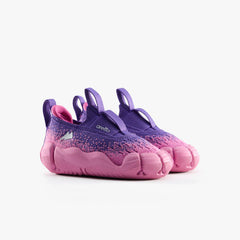 A pair of Aretto Leaps Pixl barefoot-style kids slip-on sneakers in Pixel Berry pink and purple. S1 & S2