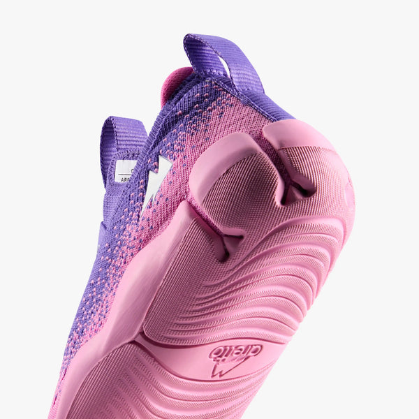 Close-up of Aretto Leaps Pixl pink and purple kids shoes showing the flexible knit material and brand logo S3 & S4