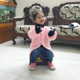 Two year old beautiful girl wearing baby pink shoes by aretto 